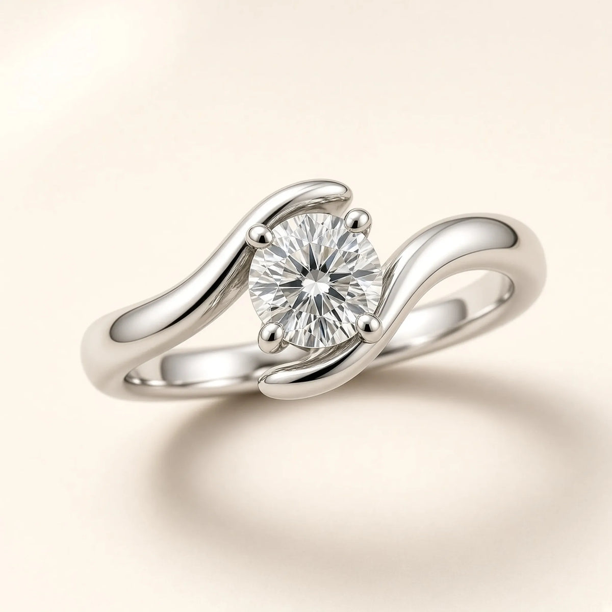Sculptural bypass ring in 18K white gold, twisting band around a four-prong round lab-grown diamond, three-quarter view