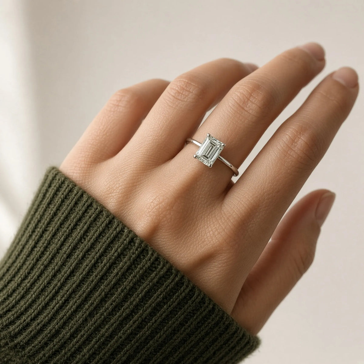2.01 ct emerald-cut lab-grown diamond, D colour, VVS2 clarity, Excellent polish, on hand in an 18K white gold solitaire