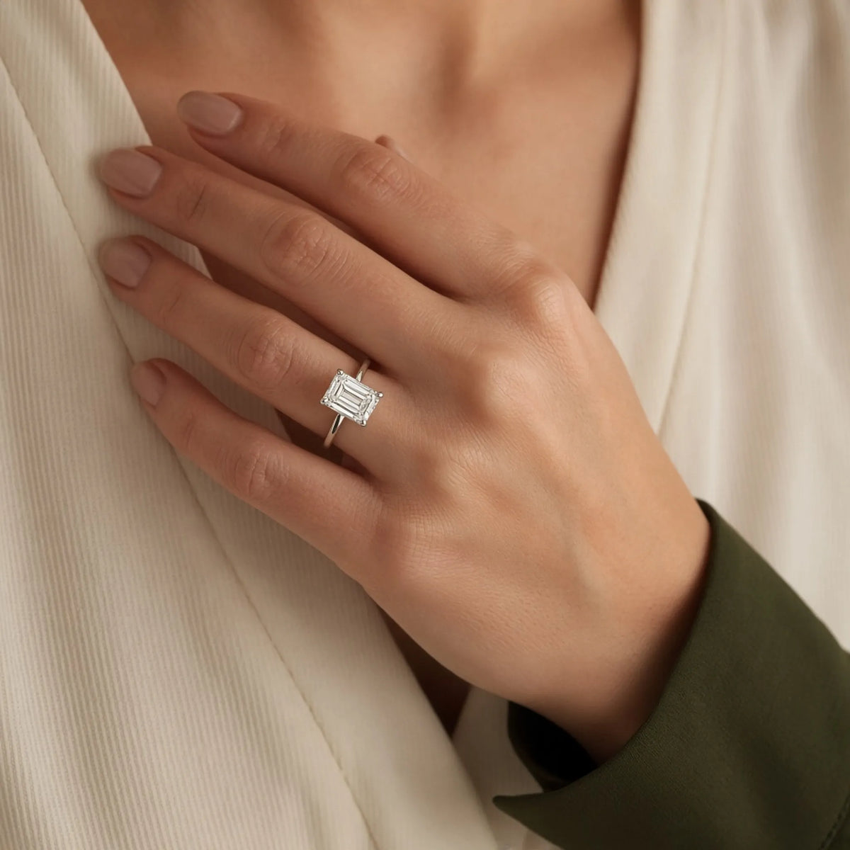 2.07 ct emerald-cut lab-grown diamond, E colour, VVS2 clarity, Excellent polish, worn in an 18K white gold solitaire, lifestyle