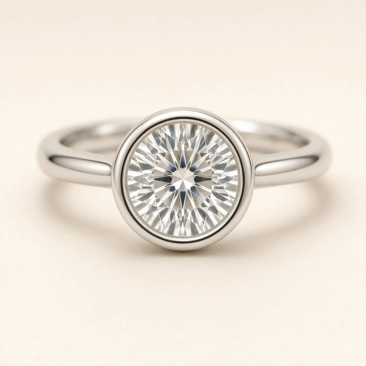 Macro close-up of an 18K white gold bezel collar around a round lab-grown diamond