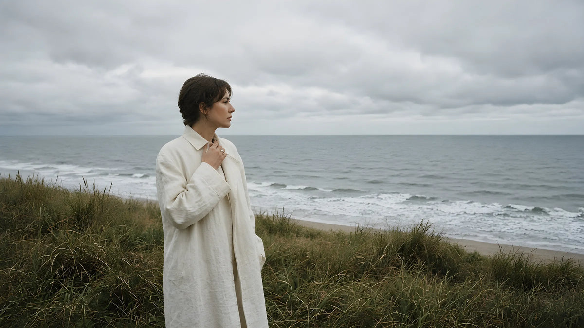 Woman on an overcast coastal dune, film look