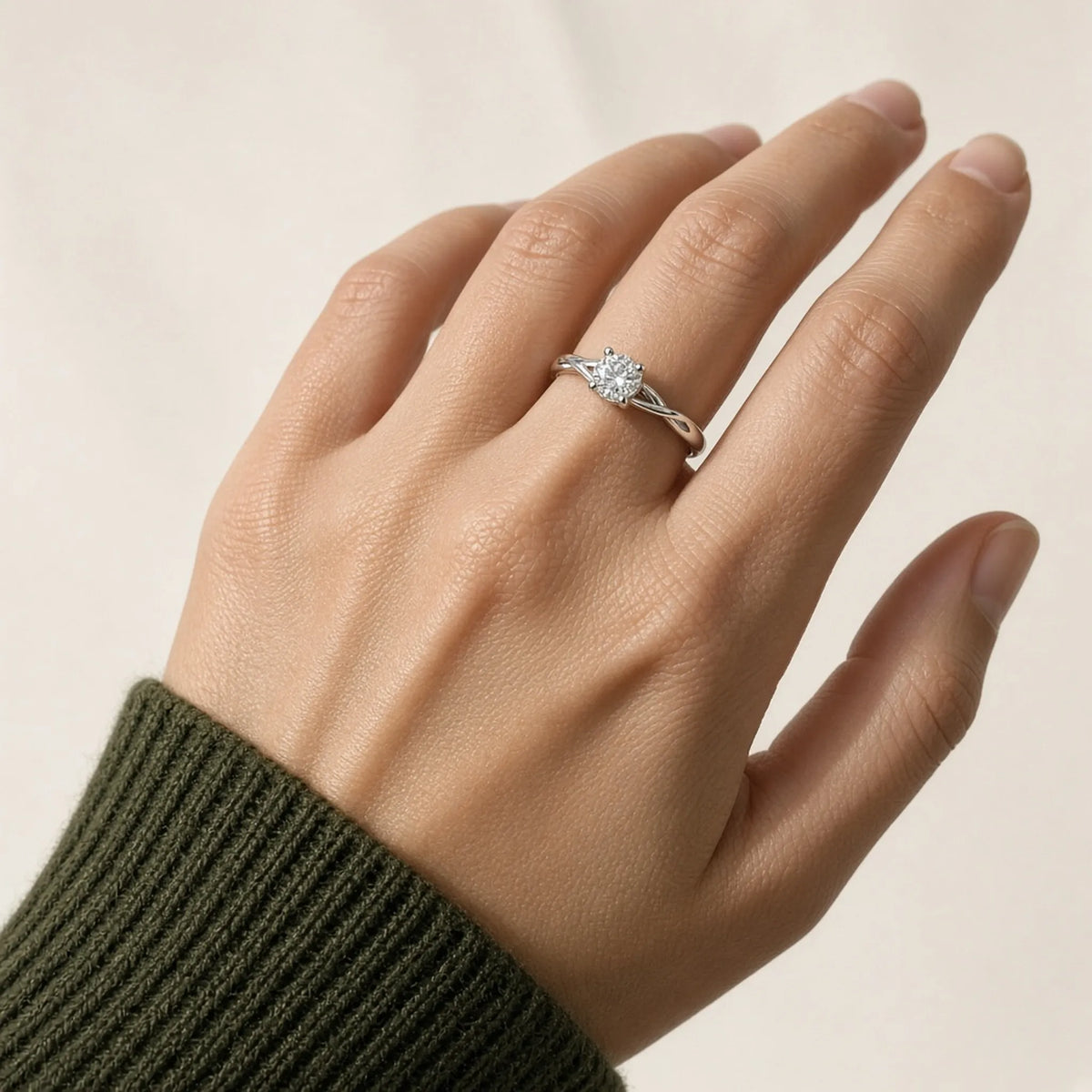 Sculptural round lab-grown diamond ring on the left ring finger