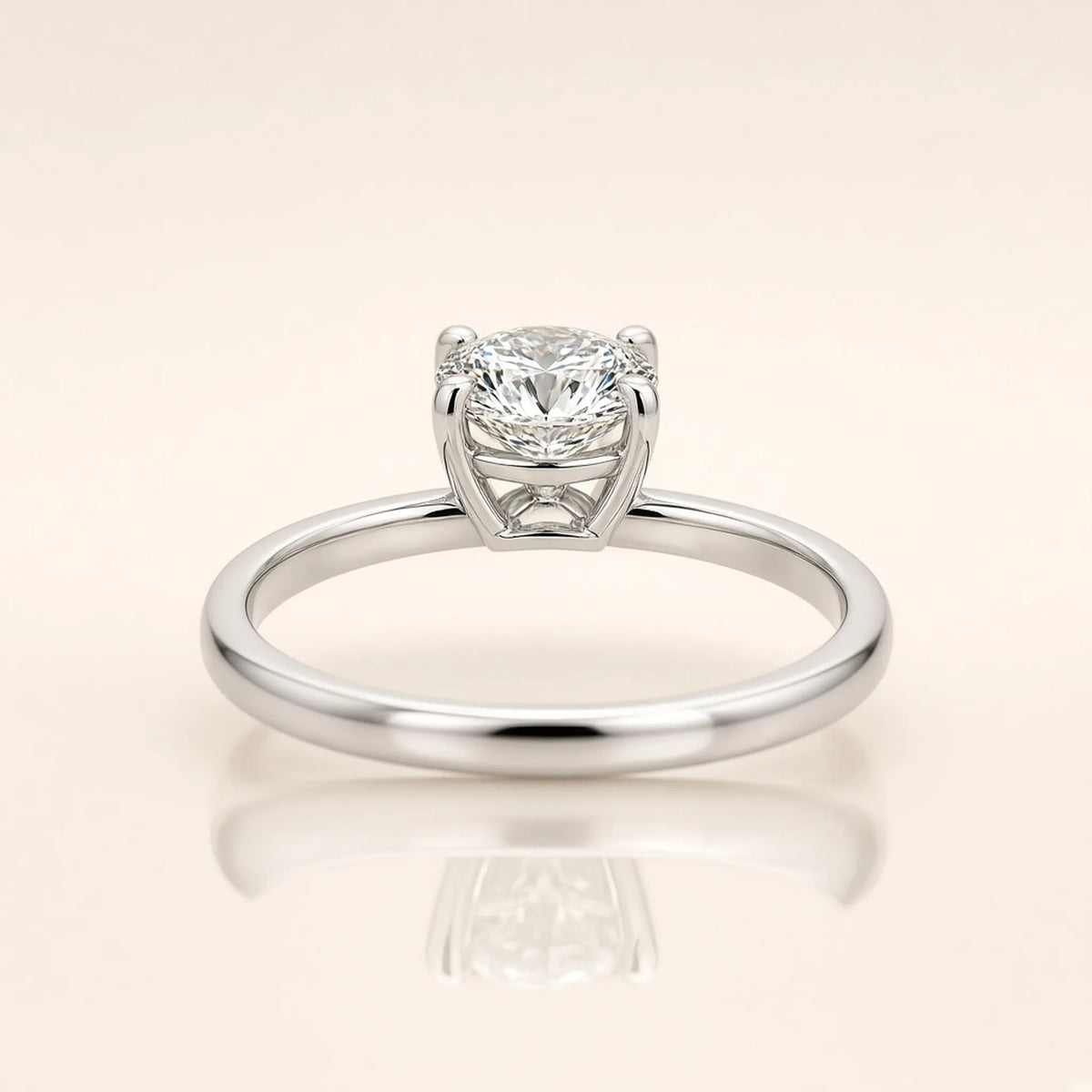 Four-prong solitaire ring in 18K white gold, rear view of the basket gallery and plain band