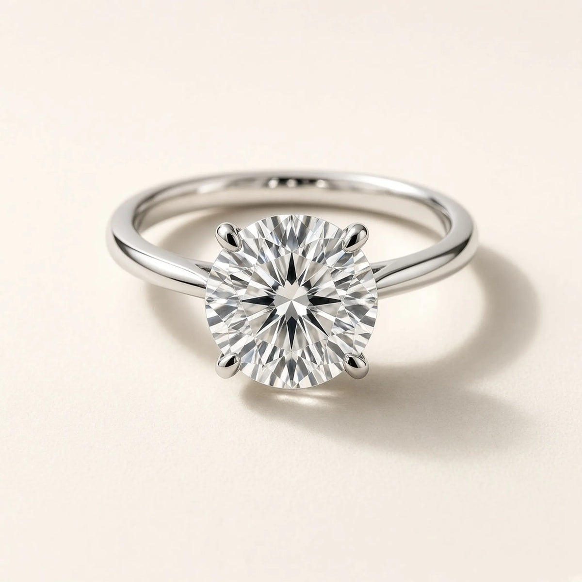 Four-prong solitaire engagement ring in 18K white gold with a round lab-grown diamond, three-quarter view
